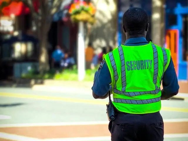 Man in Safety Vest on Street